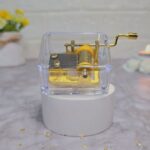 جعبه موزیکال شفاف با موتور طلایی